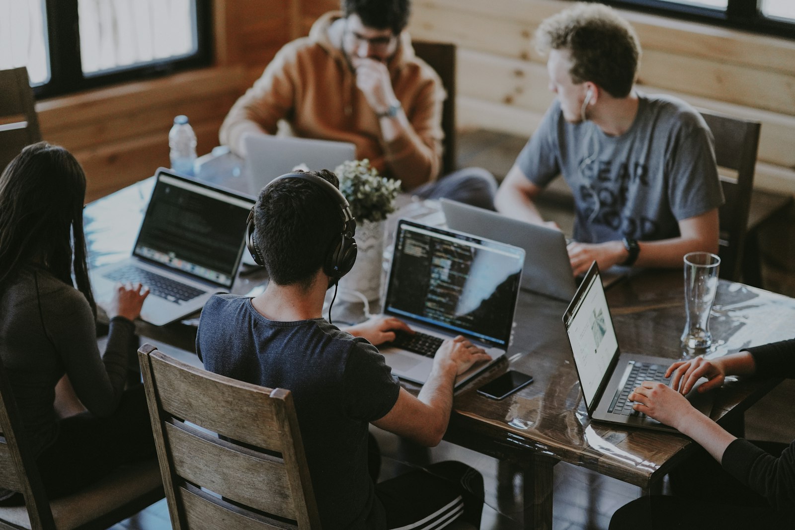 A Pod of engineers working together at laptops